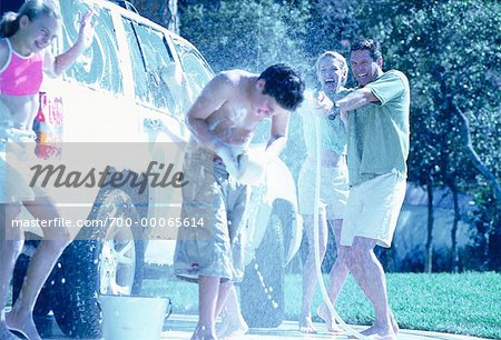 Family Washing Car, Having Water Fight