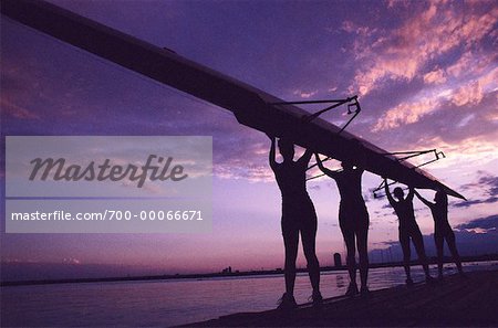 Silhouette of Rowers Carrying Boat at Sunset, Ontario, Canada