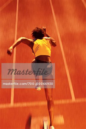Back View of Woman Running on Track