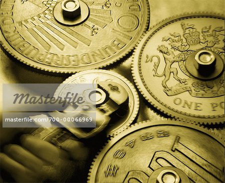 Hand Holding Wrench, Tightening Coins as Gears