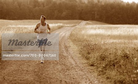 Man Running on Dirt Road Maine, USA