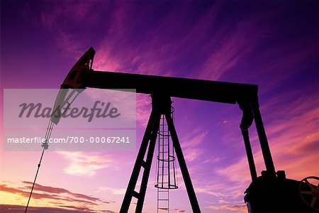 Oil Pump Jack at Sunset Airdrie, Alberta, Canada