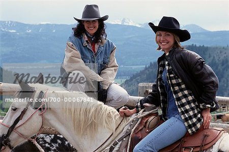 Portrait of Two Women on Horseback