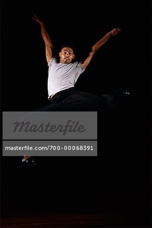 Male Dancer in Studio, Jumping in Air