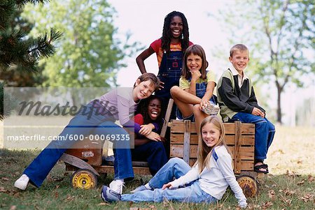 Group Portrait of Children with Soapbox Car Outdoors