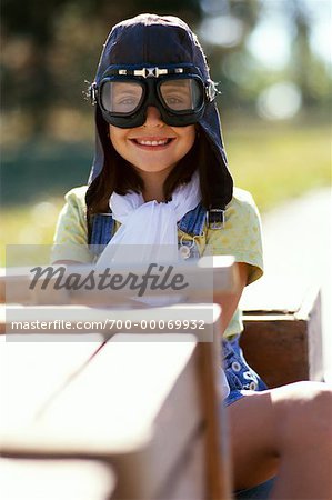 Portrait of Girl Wearing Goggles Sitting in Soapbox Car