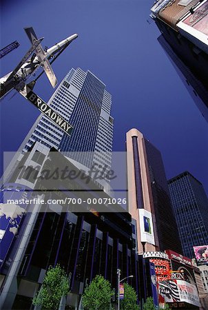 Looking Up at Street Sign and Office Towers, Times Square New York, New York, USA