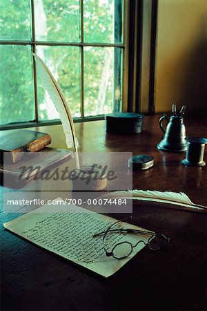 Quill Pen, Eyeglasses, Paper and Books on Antique Desk in Ralph Waldo Emerson House Concord, Massachusetts, USA