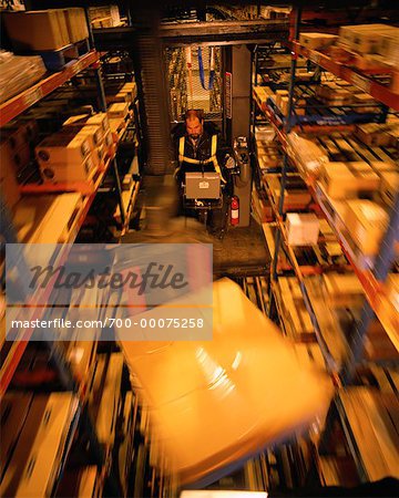 Man Operating Forklift in Warehouse