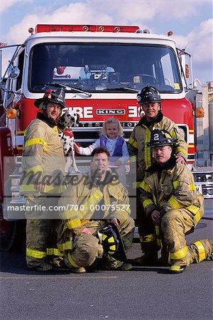 Group Portrait of Male Firefighters by Fire Engine with Girl and Dalmatian
