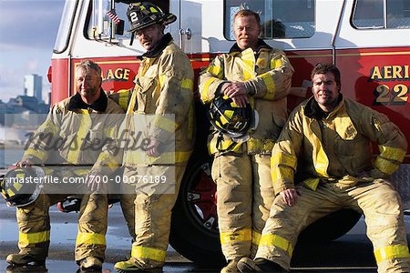 Group Portrait of Firefighters Leaning on Fire Truck