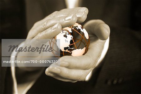 Close-Up of Businessman's Hands Holding Wire Globe North America