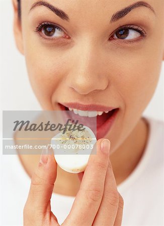 Woman Eating Deviled Egg