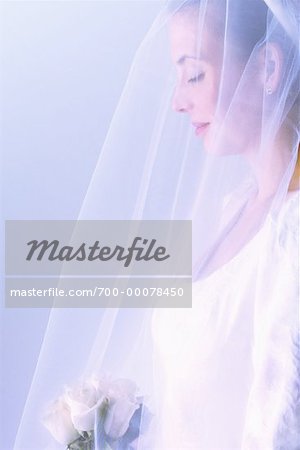 Profile of Bride Holding Bouquet Of Roses