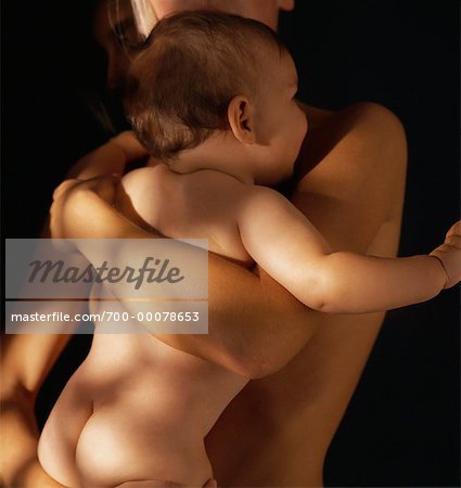 Close-Up of Nude Mother Holding Baby