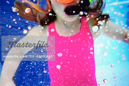 Girl in Swimwear with Snorkel Underwater