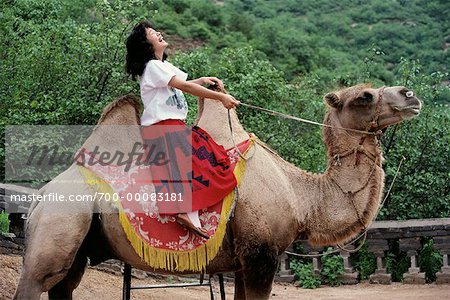 Female Tourist Riding Camel China