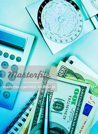 International Currency and Pen on Notebook with Calculator and Clock with Time Zones