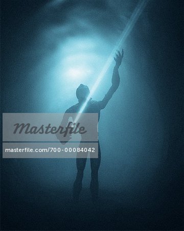 Figure of Alien Holding Flashlight in Foggy Tunnel