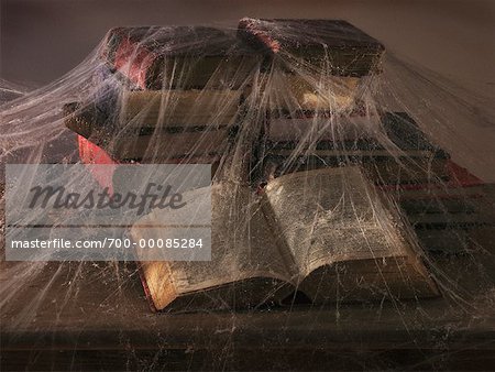 Old Books Covered in Cobwebs