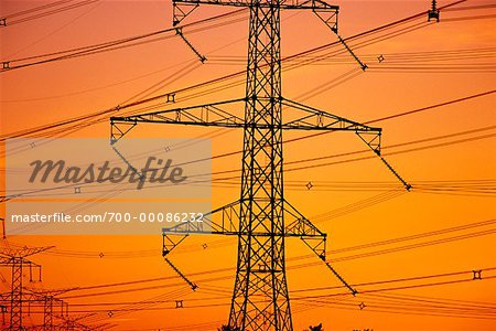 Silhouette of Transmission Tower And Power Lines at Sunset Near Toronto, Ontario, Canada