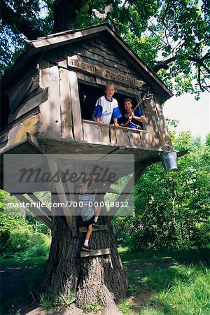 Boys Playing in Tree House