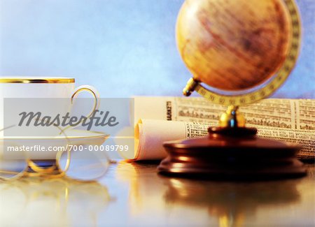 Cup, Globe, Eyeglasses and Financial Papers