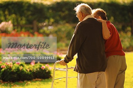 Mature Couple Walking in Garden