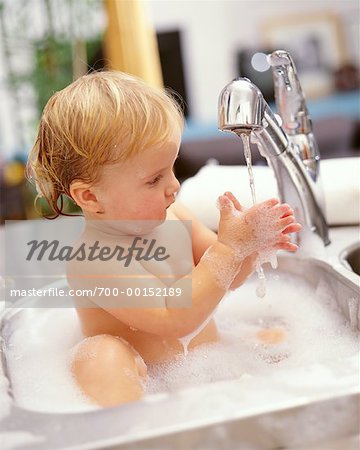 Baby Bathing In Kitchen Sink