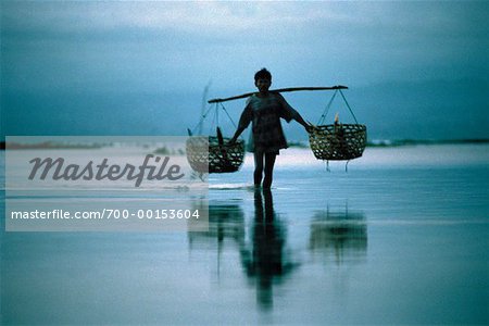 Man Carrying Baskets Nusa Lembongan, Bali, Indonesia
