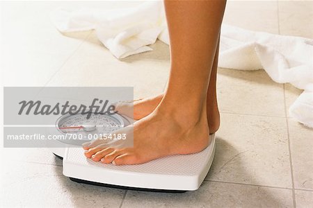 Close Up of Woman's Feet on Bathroom Scale