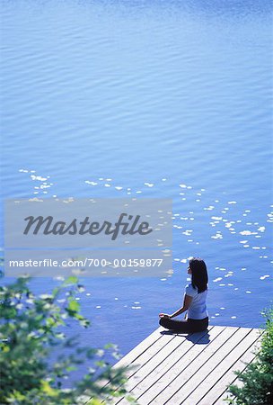 Woman Doing Yoga on Dock