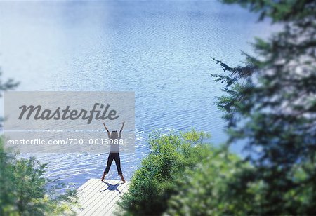 Woman Stretching on Dock