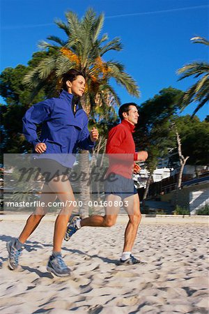 Couple Jogging on Beach