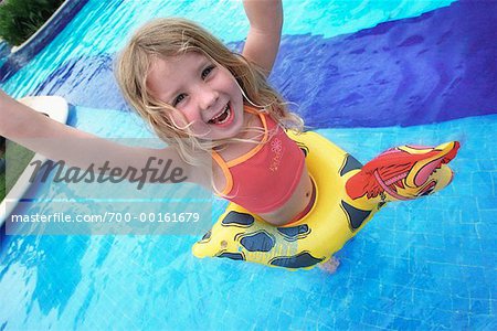 Girl Playing in Swimming Pool