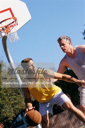 Men Playing Basketball