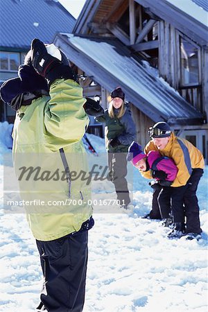 Family Having Snowball Fight