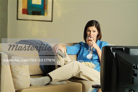 Woman Watching Television and Drinking Wine