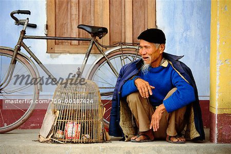 Man with Birdcage Samson Village, Vietnam