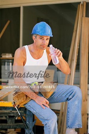 Construction Worker Drinking Bottled Water