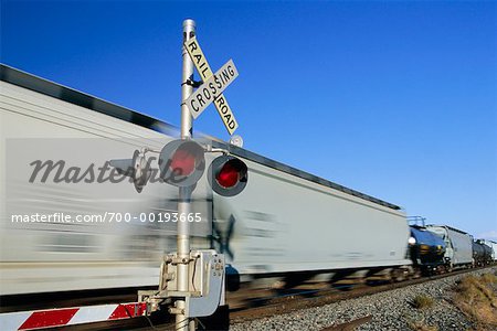Moving Train at Railroad Crossing