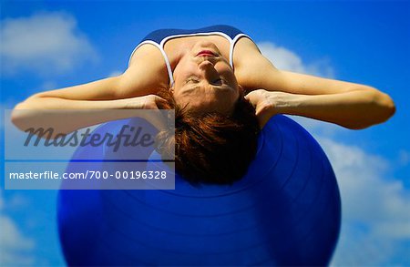 Woman Using Exercise Ball