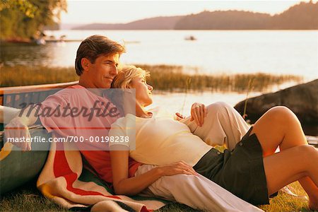 Couple Relaxing by Lake