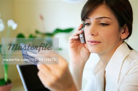 Woman on Phone with Credit Card