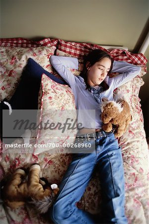 Teenage Girl Lying on Bed