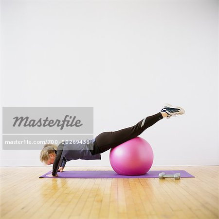 Woman Using Exercise Ball