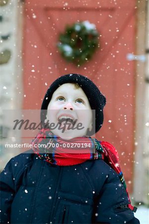 Boy Catching Snowflakes on Tongue