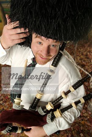 Man Using Bagpipes