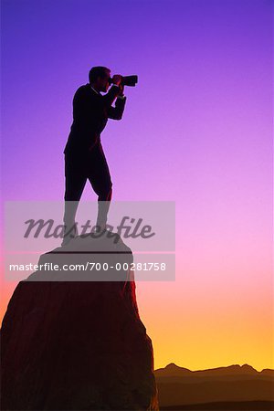 Man on Cliff with Binoculars
