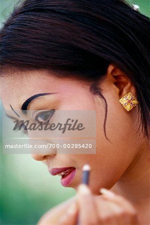 Balinese Dancer Applying Make-Up